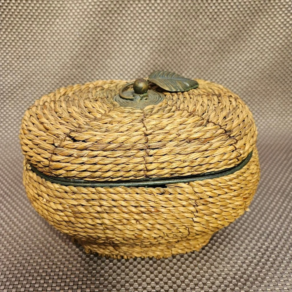 Vintage hand-woven coiled rye straw rattan wicker basket with metal leaf topper